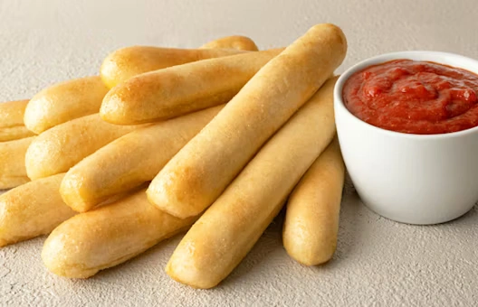 Dozen Signature Garlic Breadsticks with Large Dipping Sauce
